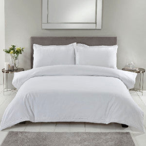 A Duvet Cover Set in white with 1000 thread count of long staple egyptian cotton in a modern bedroom