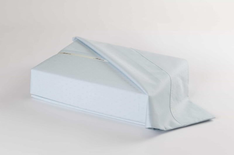 A Swiss Dot bed sheets set with long staple cotton in blue