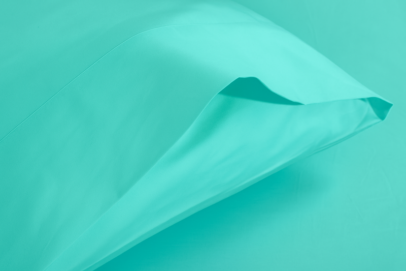 A blue coloured Bamboo Rayon Pillow Case against a white background from Hometrend, a Canadian bedding store