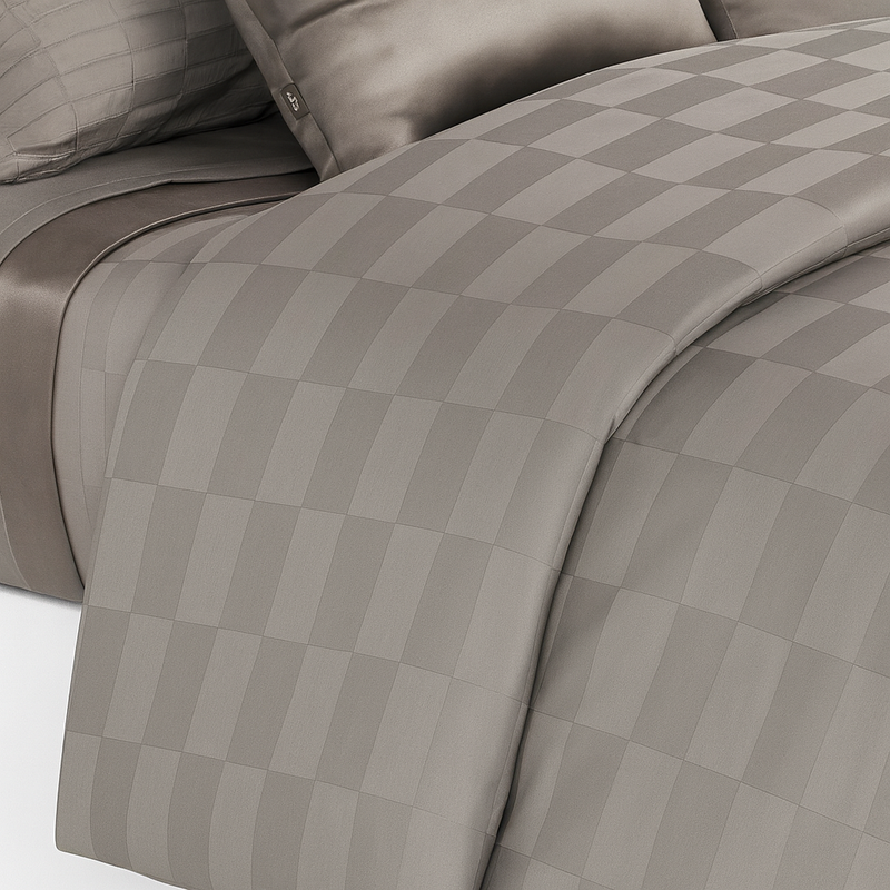 A checker pattern sheet set and duvet cover set in silver grey color on a bed from Hometrend, a Canadian Bedding store 