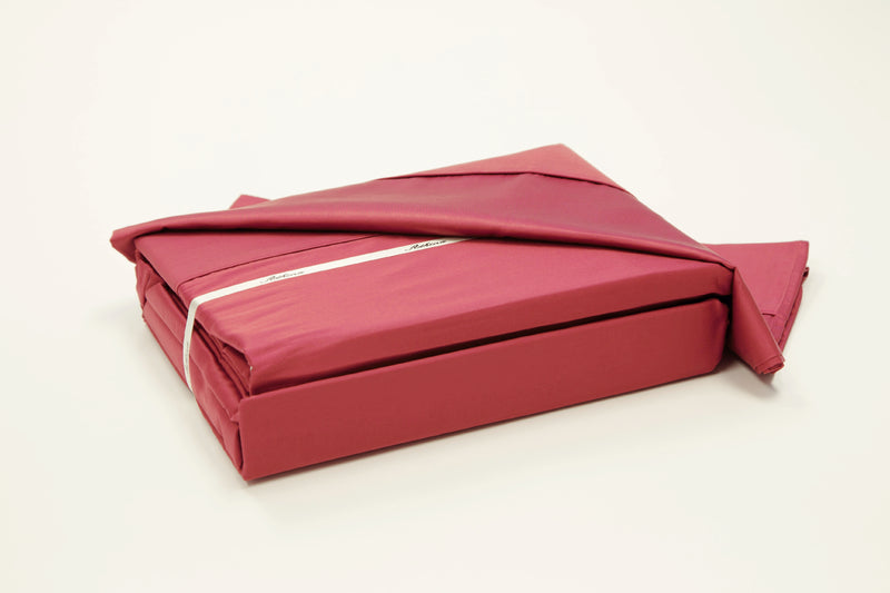 A 100% Long staple Egyptian cotton sheet set including pillow cases in a red or rust color