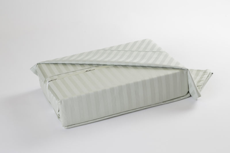 A picture of a 100% Super egyptian cotton duvet cover set in a light green or celadon color